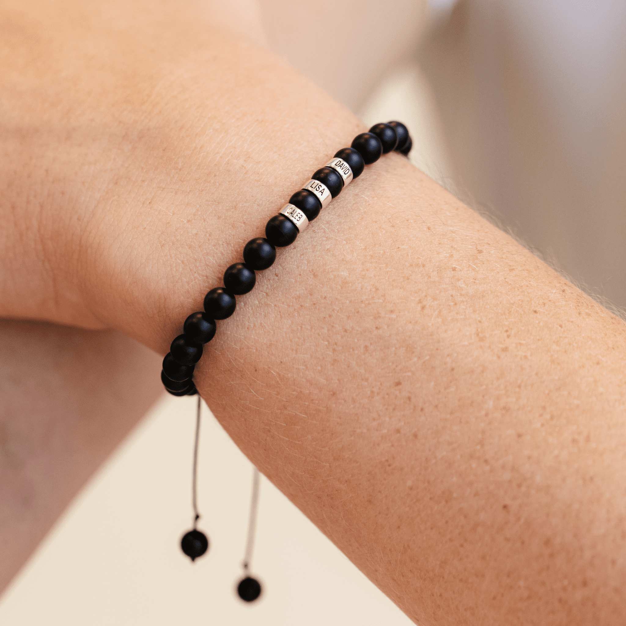 Movado | Men's Black Onyx Beaded Bracelet with Silver Signature Bead in Mixed metals/black