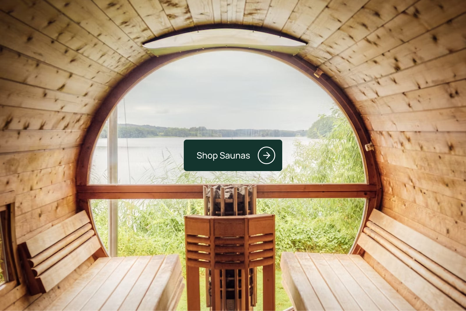Inside of a barrel sauna overlooking a lake