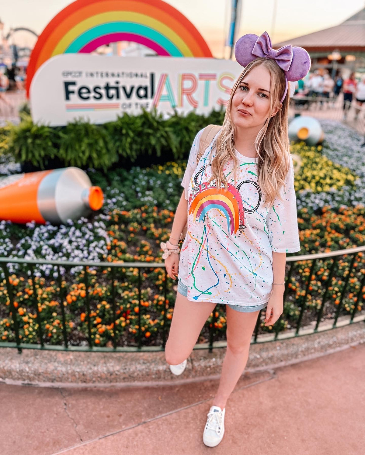 woman-wearing-art-is-magic-rainbow-splatter-tee