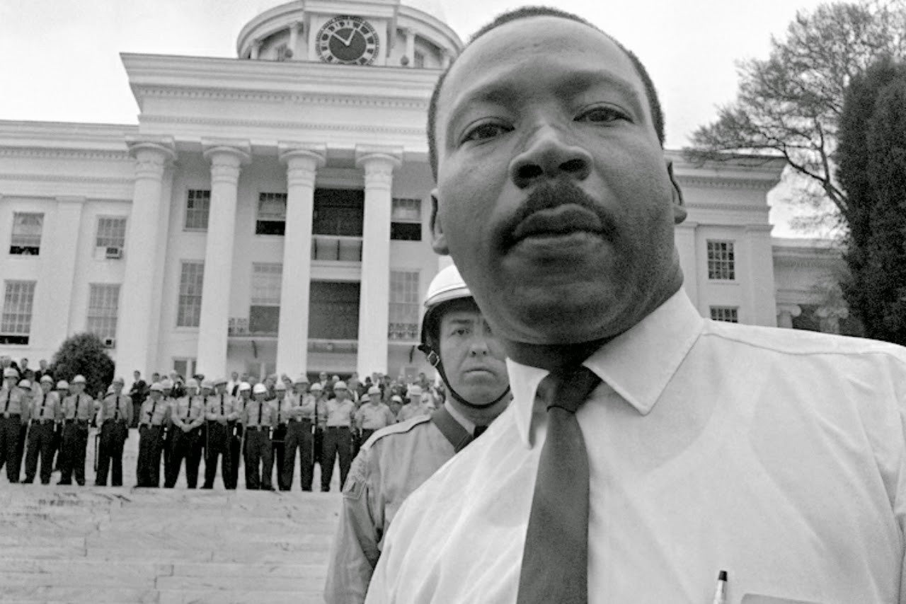 Dr. King in front of the Alabama state capitol.