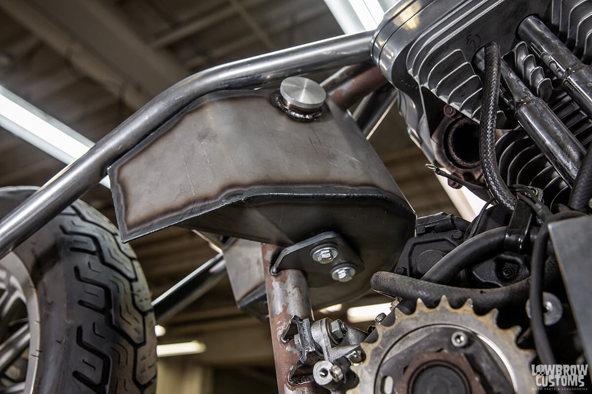 What the lower mounting tab looks like and how it was tacked to the frame of the custom 2000 Harley Sportster.