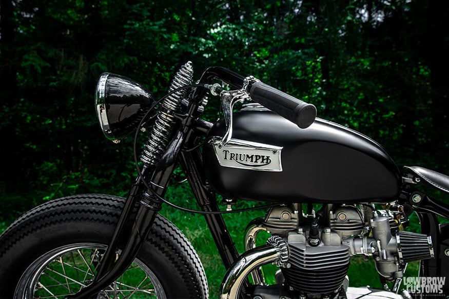 The black paint really makes this custom 1968 650cc Triumph Bonneville Bobber pop.