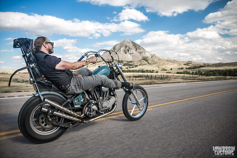 Mount a rear motorcycle fender with sissy bars for extra comfort on the road