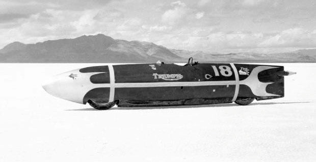 Johnny Allen riding "The Devils Arrow" broke the overall fastest motorcycle record by flying down the Bonneville Salt Flats at 193.7 mph in 1955. The Stream liner was 15.7 foot-long and powered by a methanol burning, 1950 Triumph Thunderbird 650 twin motor. Lowbrow Customs, The History of Triumph Motorcycles