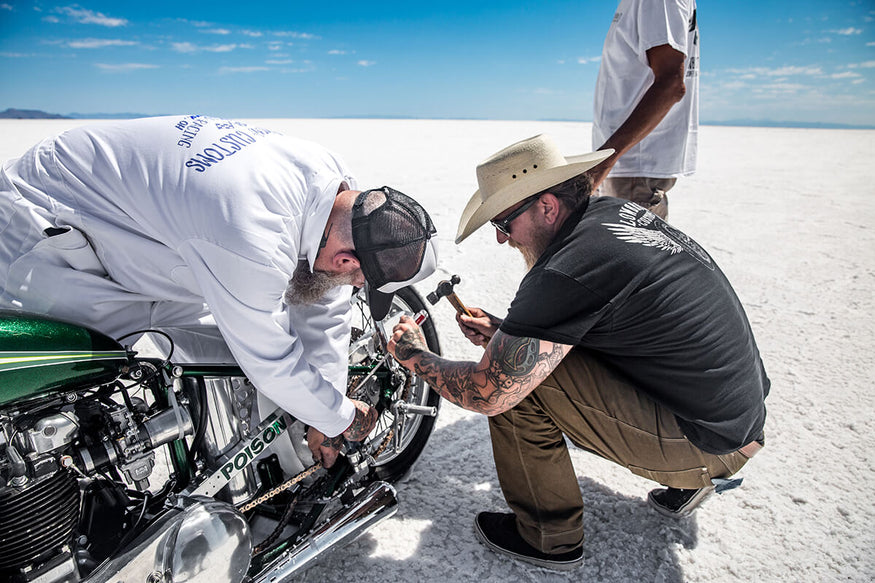 The wheel was cocked to the left and the chain hanging off, Kyle and Joe hurried to get the master link off the chain so the bike will roll freely into the chase van. - Bonneville Speed Week 2017 - Lowbrow Customs