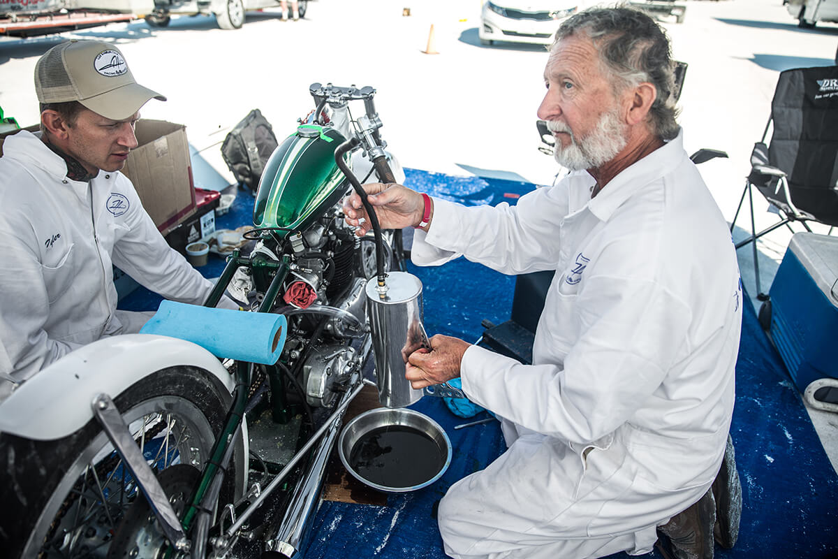 Denny draining the oil bag. - Bonneville Speed Week 2017 - Lowbrow Customs