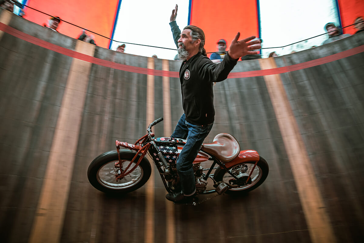 Charlie Ransom standing and no hands on the American Wall of Death. - Lowbrow Customs - Cycle Showcase 2017 - St. Louis