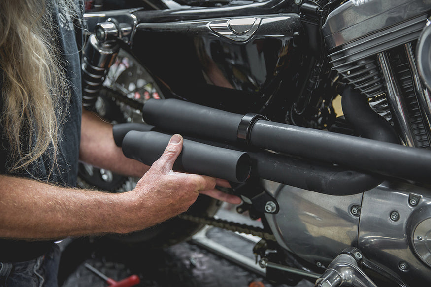 Todd lining up the second Mini Muffler to where he wants to mount it, and marking it to be cut. Lowbrow-Customs-Cycle-Source-techtip-install-biltwell-mini-mufflers-6091