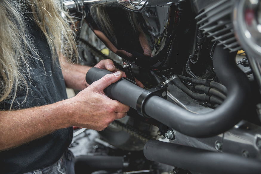 Todd loosely attaching the Mini Muffler to the rear pipe and bracket. Lowbrow-Customs-Cycle-Source-techtip-install-biltwell-mini-mufflers-6139