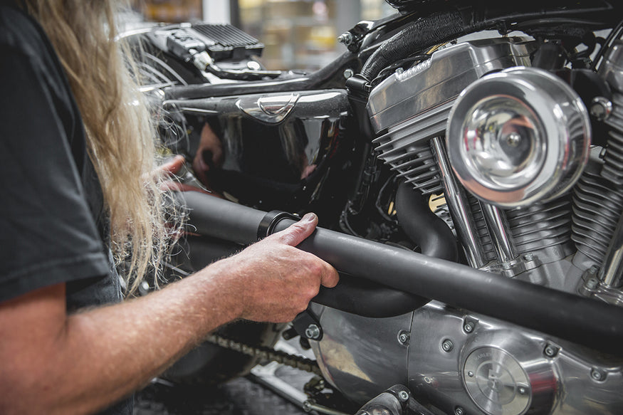 By loosely installing both pipes, it makes for an easier time to line up the pipes evenly. Lowbrow-Customs-Cycle-Source-techtip-install-biltwell-mini-mufflers