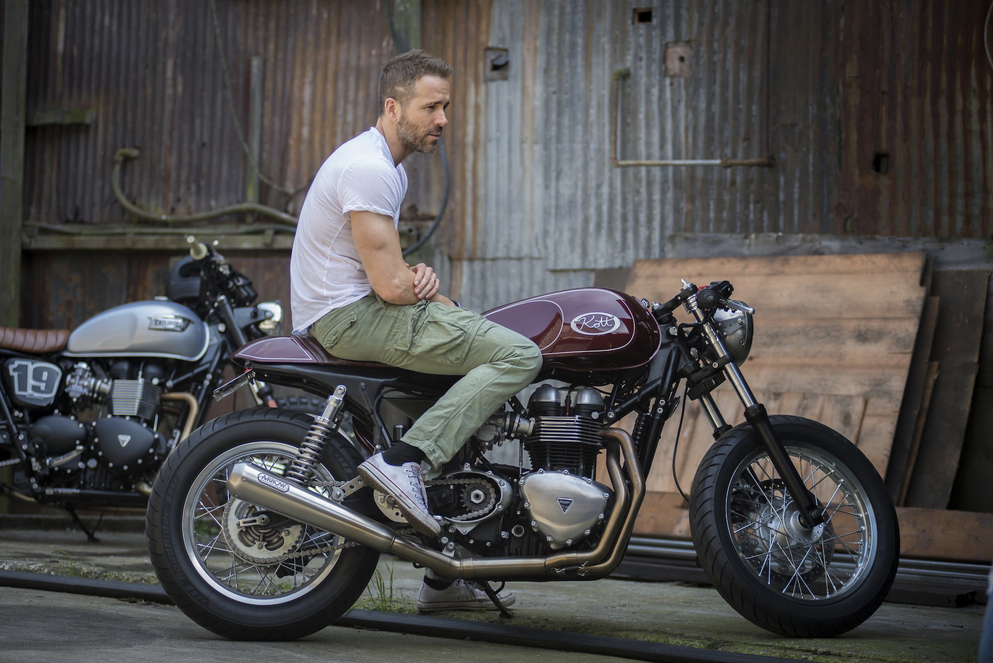 Ryan Reynolds and his Triumph Thruxton cafe racer. Famous motorcycle riders