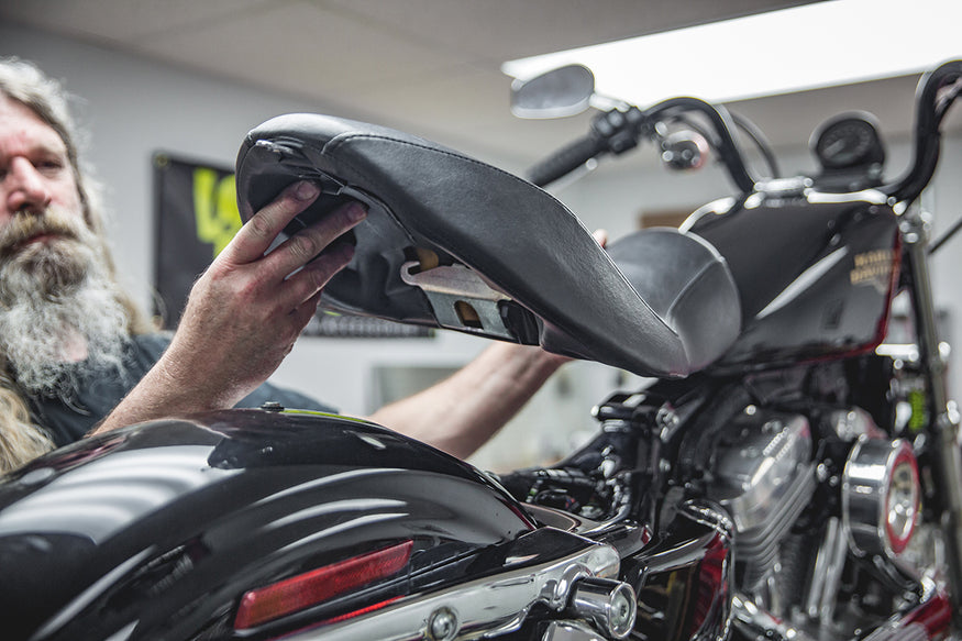 Todd showing how easy your seat will come off. Lowbrow Customs, How to install Le Pera Seat and Gasbox Sissybar - Sportster2