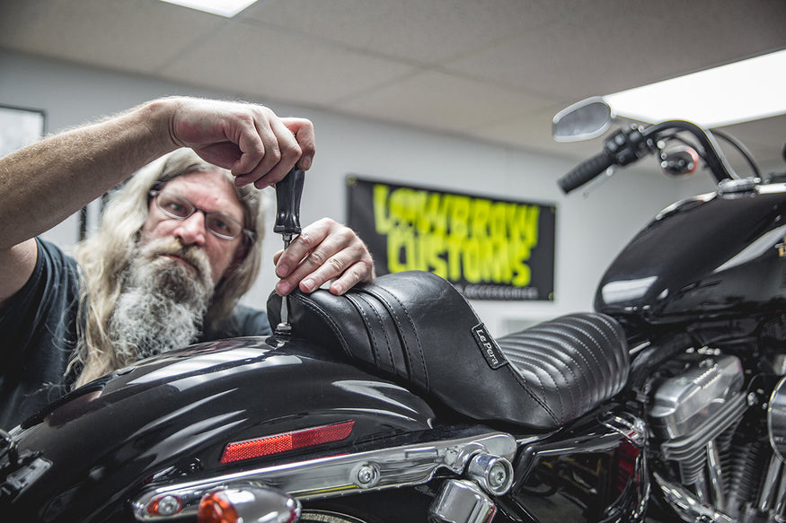 Todd mean mugging and showing this seat who's boss. Lowbrow Customs, How to install Le Pera Seat and Gasbox Sissybar - Sportster5