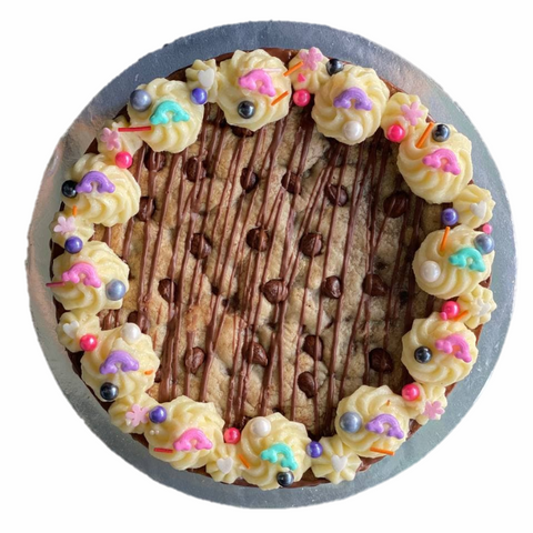 Pictures show a cookie cake with nutella drizzle and rainbow shaped sprinkles