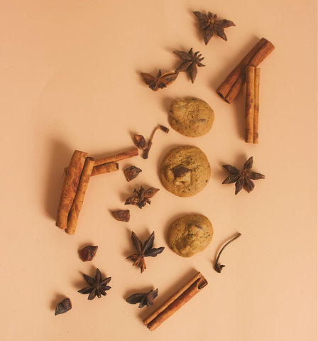 Image shows a few pieces of our Chai Latte cookies along with loose pieces of Cinnamon sticks and Star of Anise