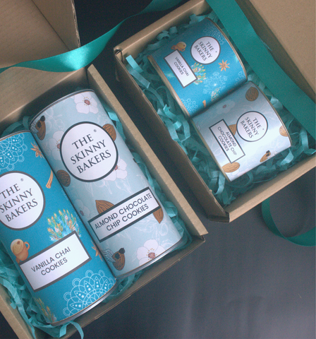 Image shows 2 of The Skinny Bakers' gift boxes within kraft box