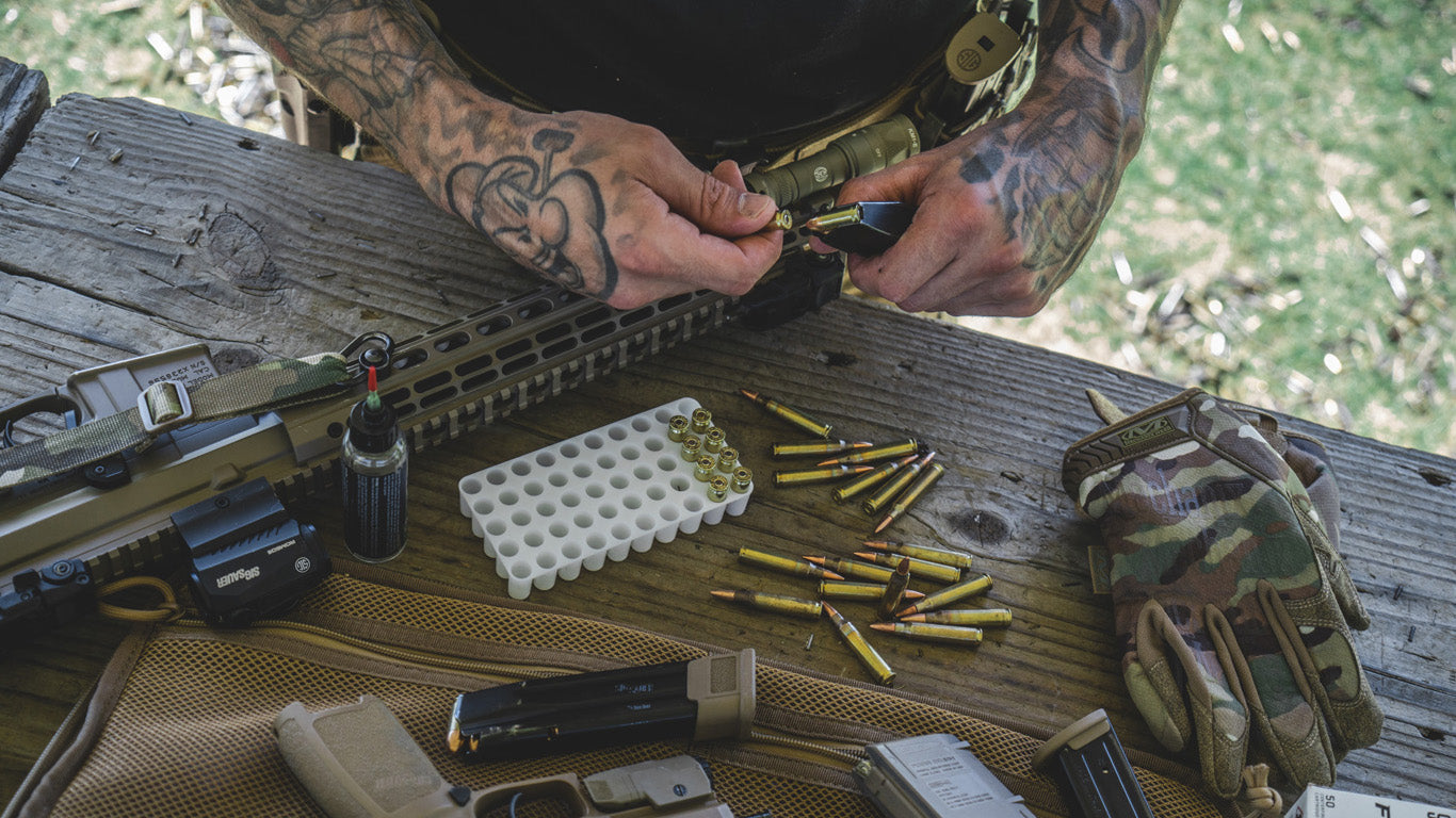 Close-up of a shooter's hands in Mechanix Wear The Original Multicam Tactical Gloves, highlighting the glove's functionality and fit.