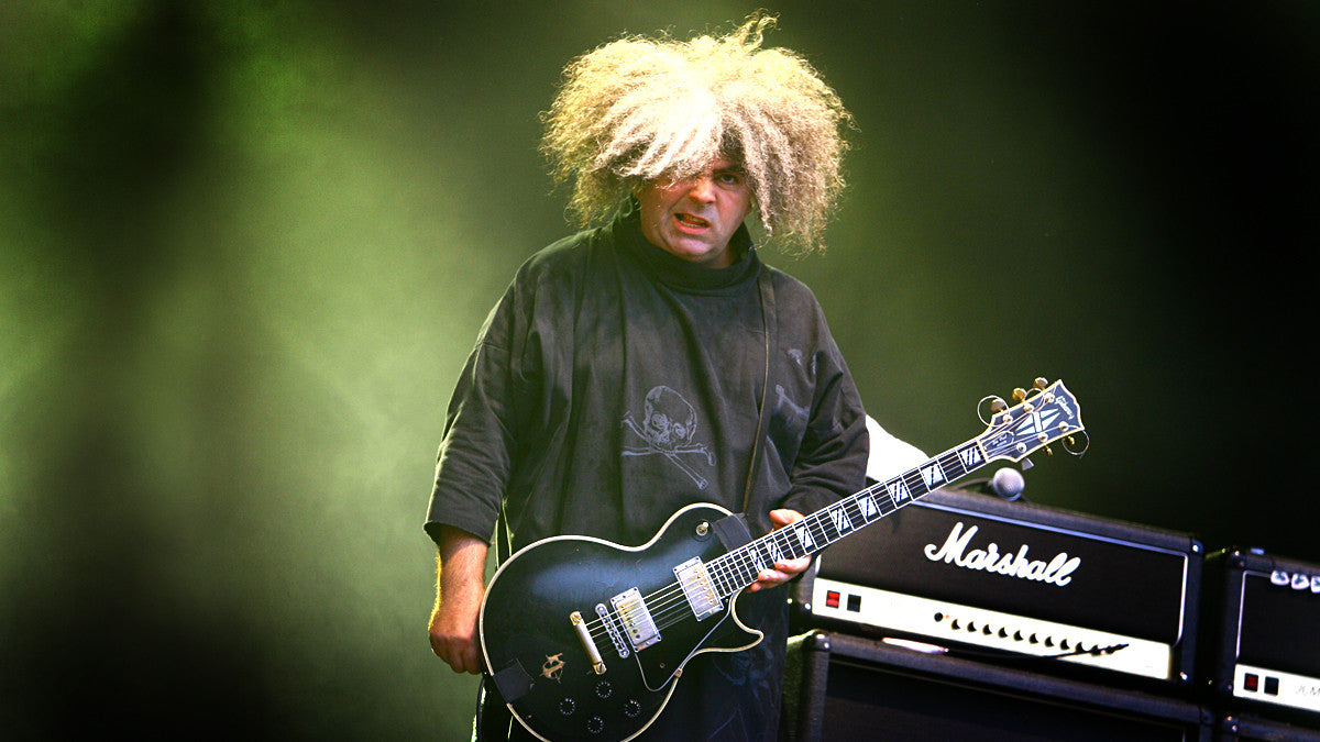 Buzz Osborne on stage with a black Les Paul