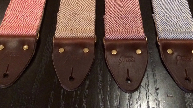 Closeup of the vintage-style leather end tabs on these new guitar straps