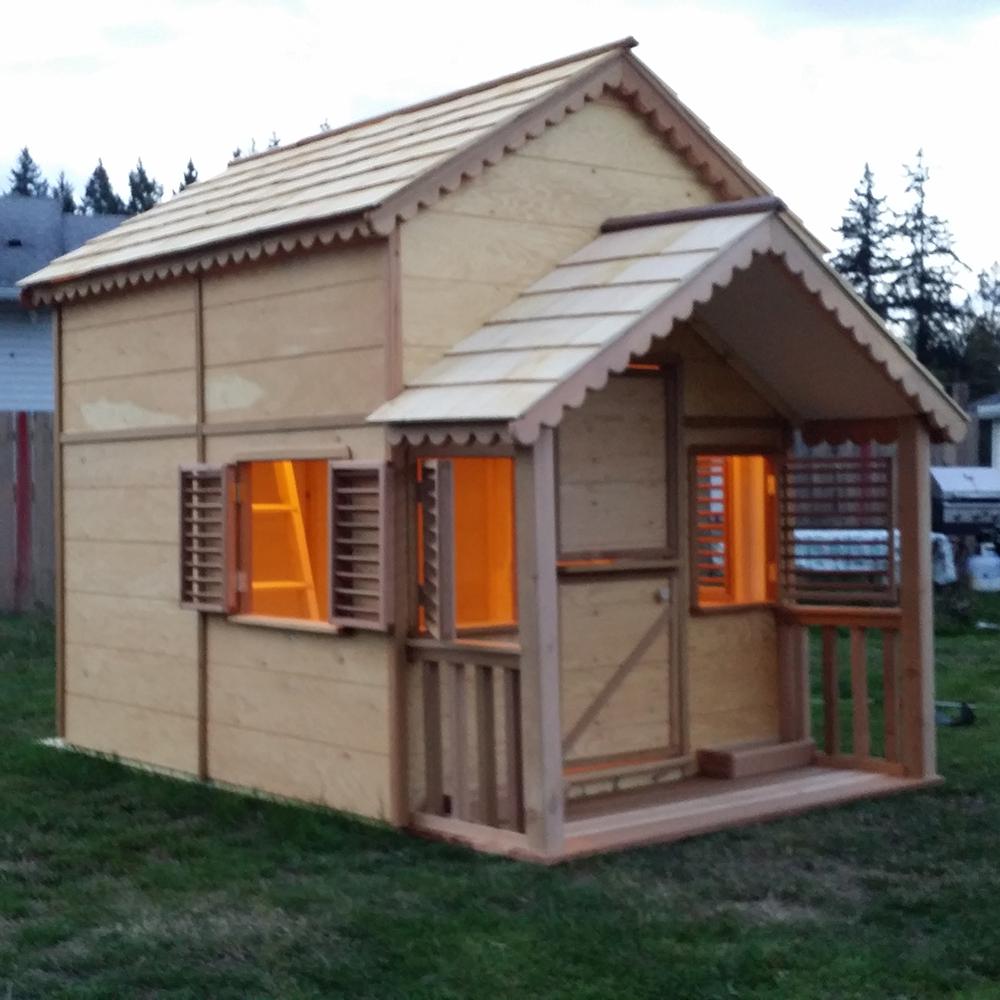 wooden playhouse with loft