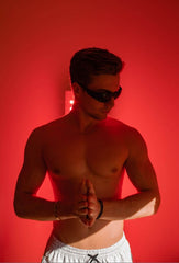 Male Wearing Glasses During Red Light Therapy
