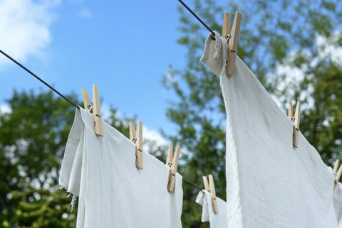 White sheets put for drying 