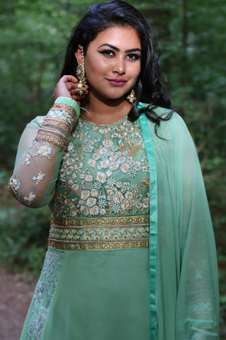 Woman in a green salwar kameez 