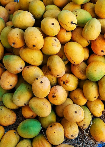 A bunch of juicy, ripe, yellow mangoes 