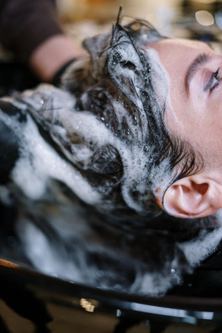 Woman getting her hair washed