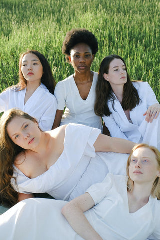 Group of women in white dresses