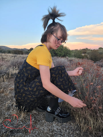 Tween girl picking wild california buckwheat on summer day