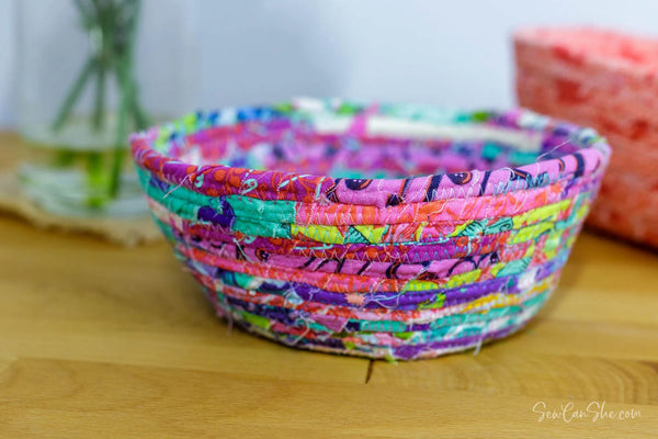 Handmade bowl composed of fabric ropes on table