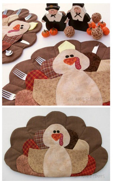Quilted turkey placemat with feathers as pockets holding table utensils