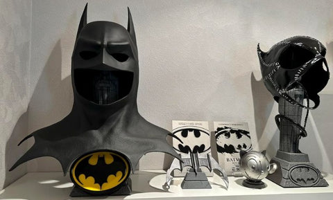 Photo of the PureArts Batman 1989 Cowl Replica and the Batman Returns Catwoman Mask Replica side by side!