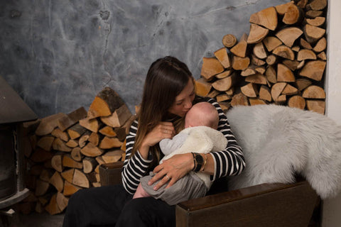 sheepskin rug in moon grey colour, perfect to snuggle up on your nursing chair