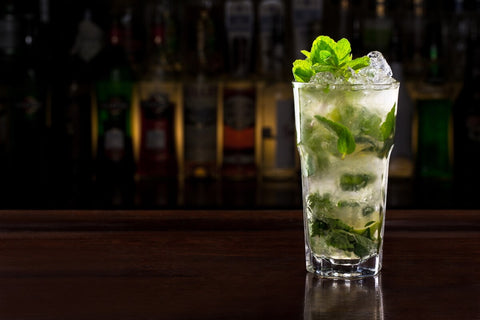 Picture of a Mojito glass on a bar