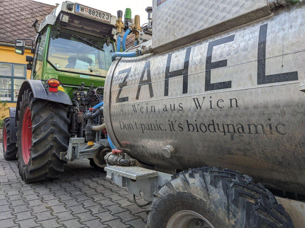 Picture of Zahel winery front yard with green tractor and tank