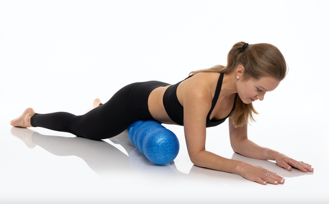 Laying down on the Rollga foam roller to release tight hip flexors and the PSOAS muscle to help sore backs and hips