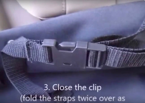 image showing how to install dog seat cover, close the clip, fold straps twice step 3