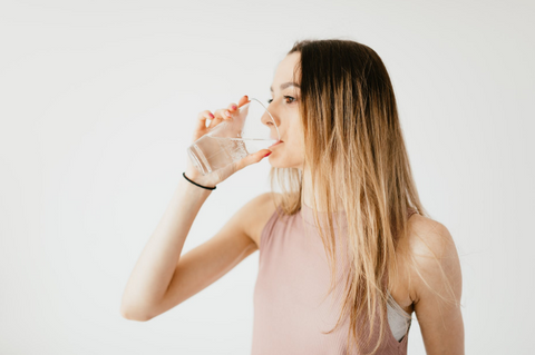 woman drinking glass of water