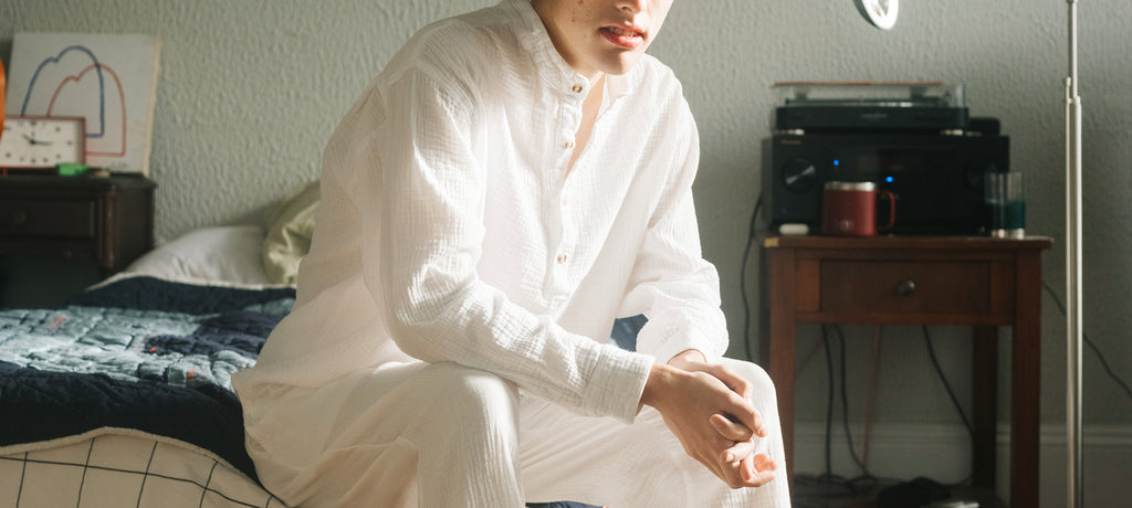 Model is wearing our Relaxed Cotton Long Sleeve Shirt in White.