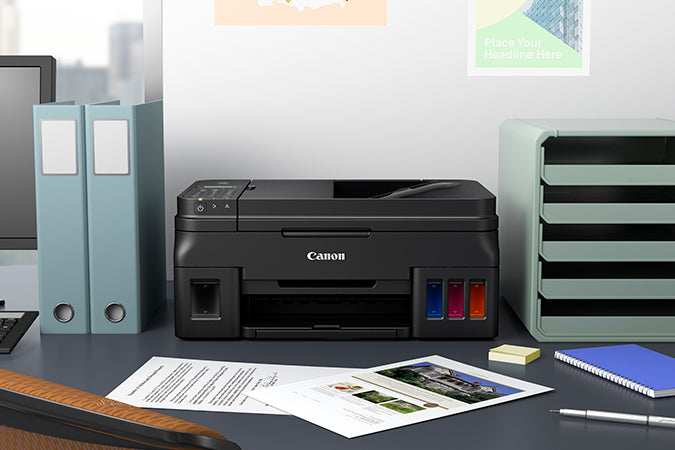 impresora canon pixma g4110 sobre escritorio de oficina