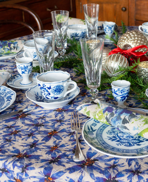 Blue and white table scape with blue floral linen table cloth and napkins