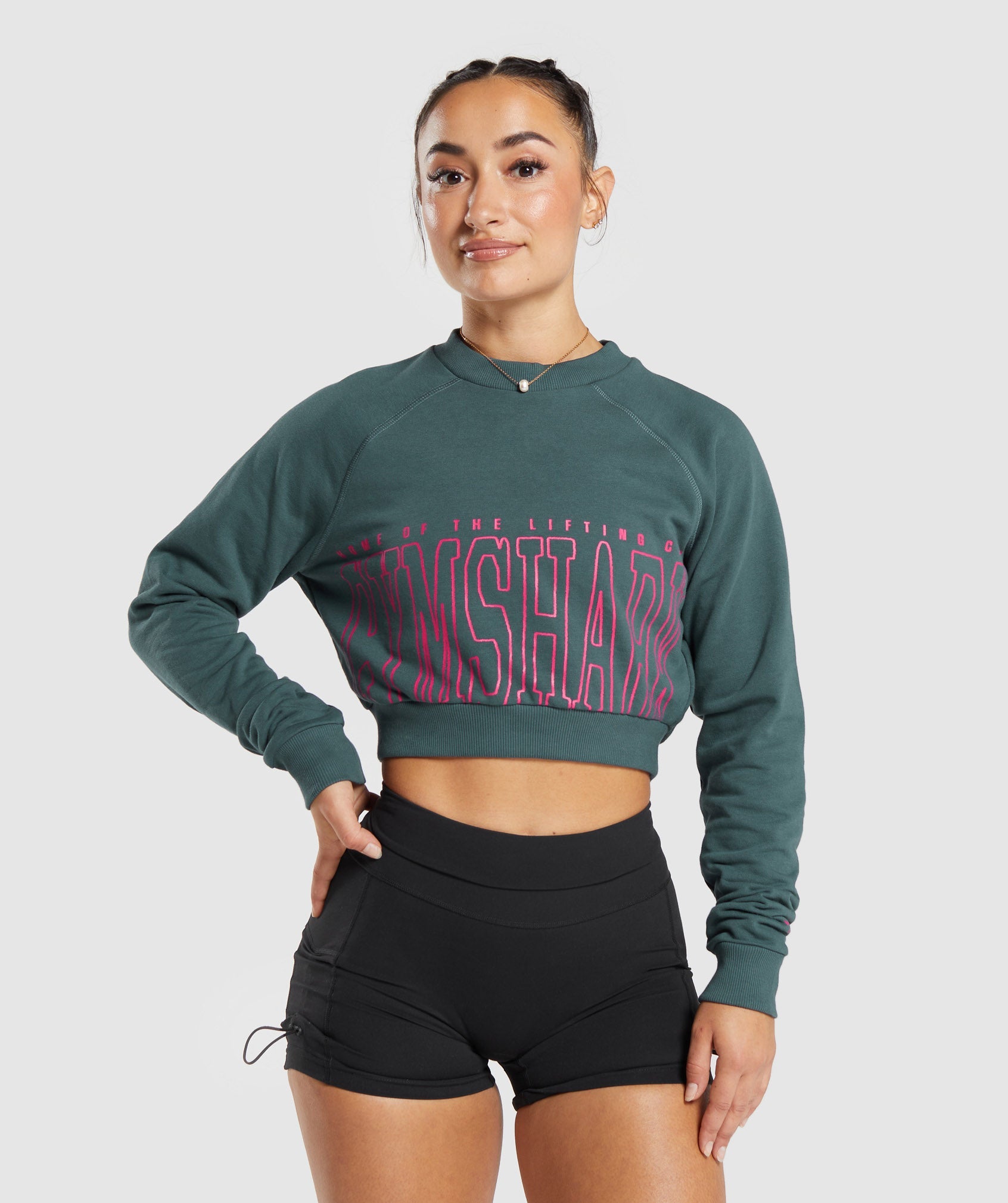 Lifting Graphic Cropped Sweatshirt in Smokey Teal - view 1