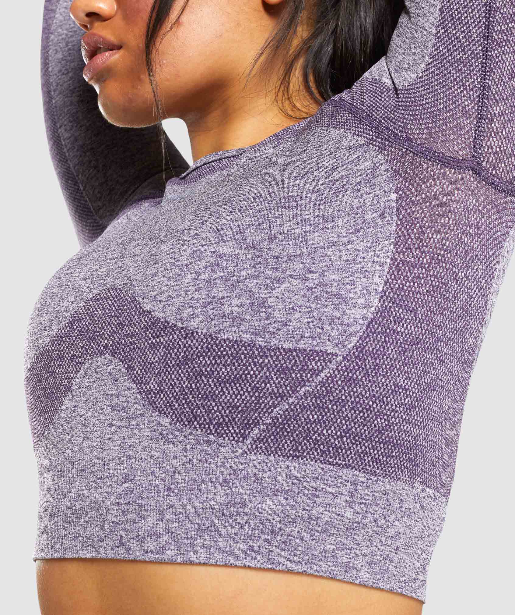Purple sports top with long sleeves and cut neckline