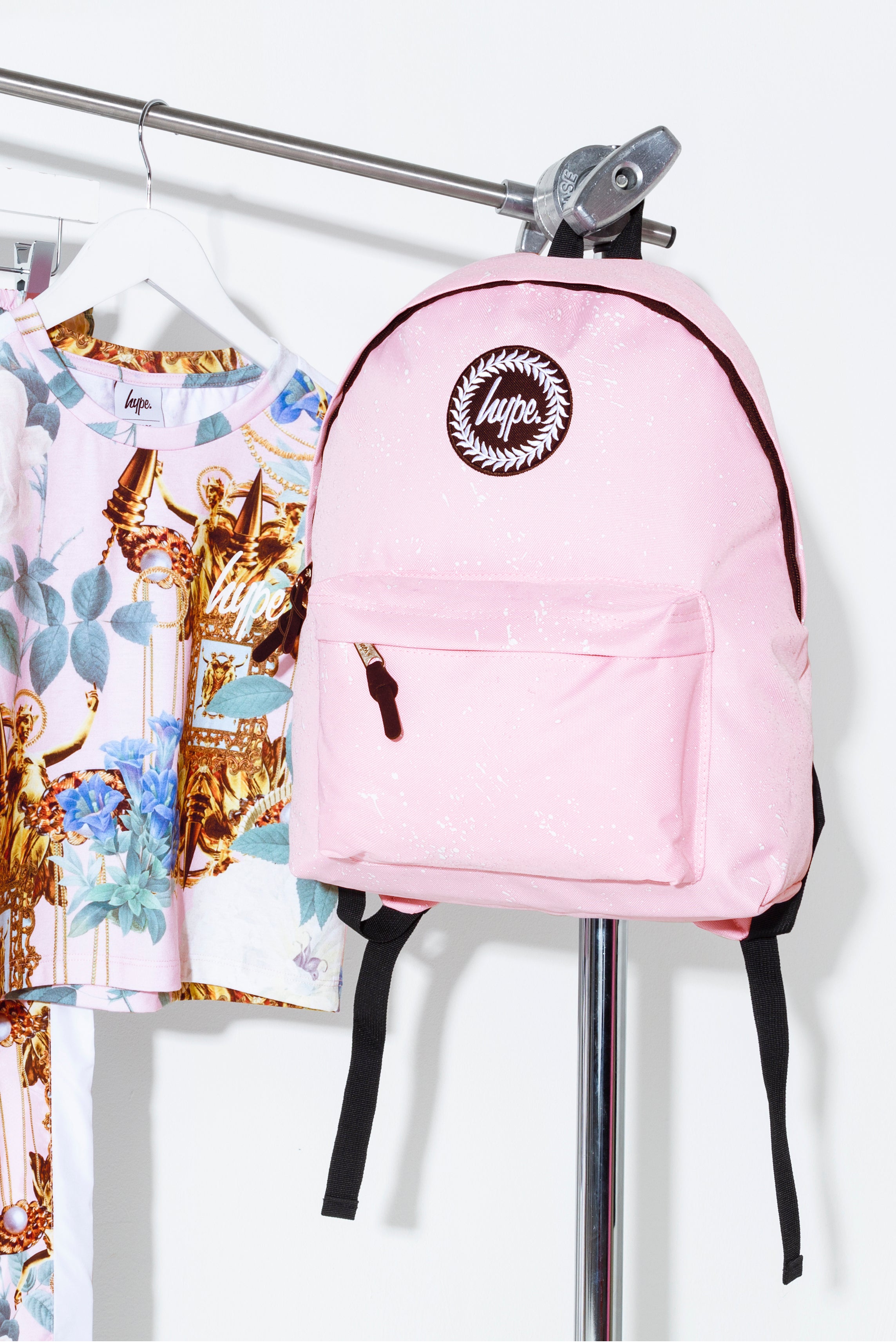 white and pink backpack