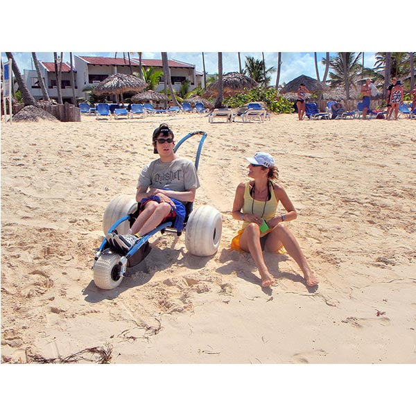 VipaMat Hippocampe Beach All-terrain Wheelchair- with person using the product in the beach