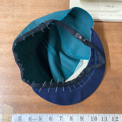 Panel cap headband being pinned in place