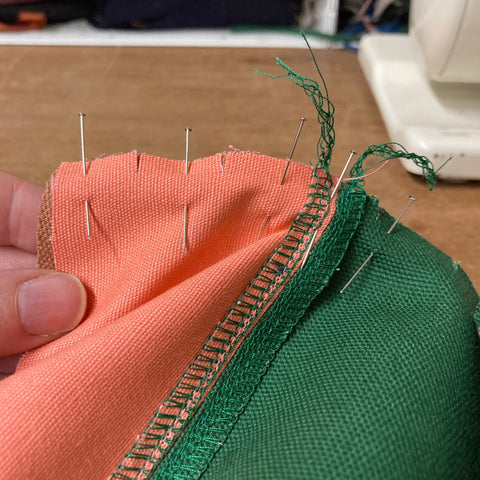 Cap panel pieces pinned together to sew