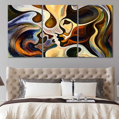 colorful canvas wall art above the bed